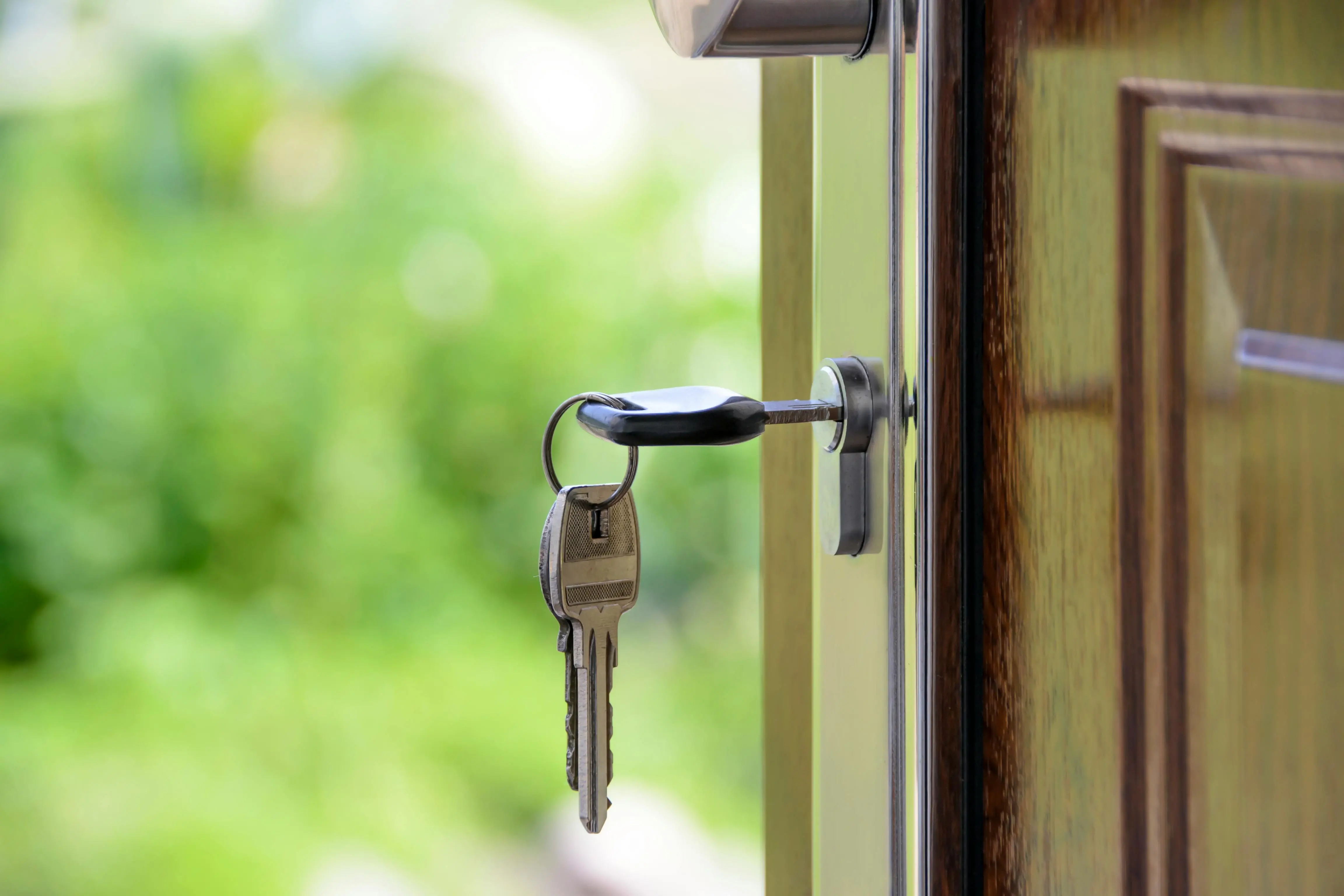 ID: House key in the front door of a home